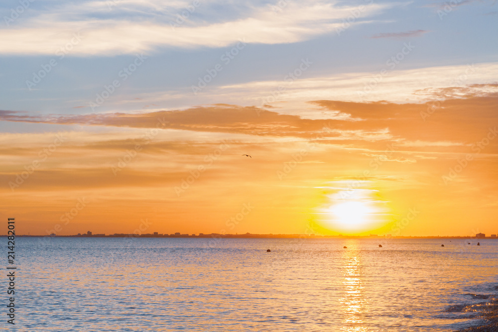 Fototapeta premium Beautiful summer sunset with clouds over the sea