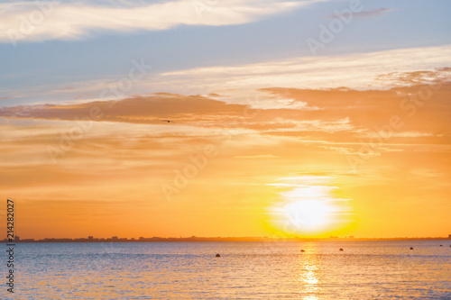 Beautiful summer sunset with clouds over the sea