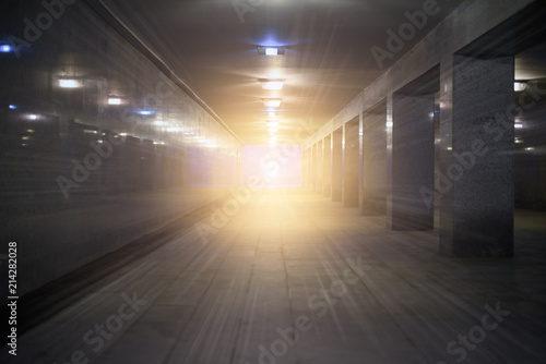 Fototapeta Naklejka Na Ścianę i Meble -  Tunnel underground pedestrian crossing with a bright glow at the end