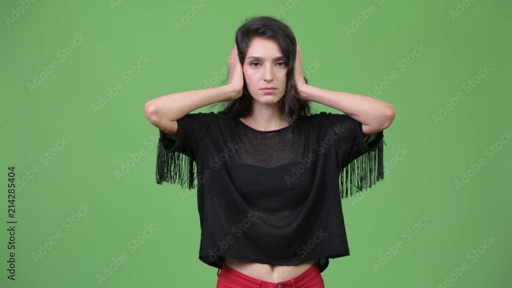 Young beautiful woman showing three wise monkeys concept