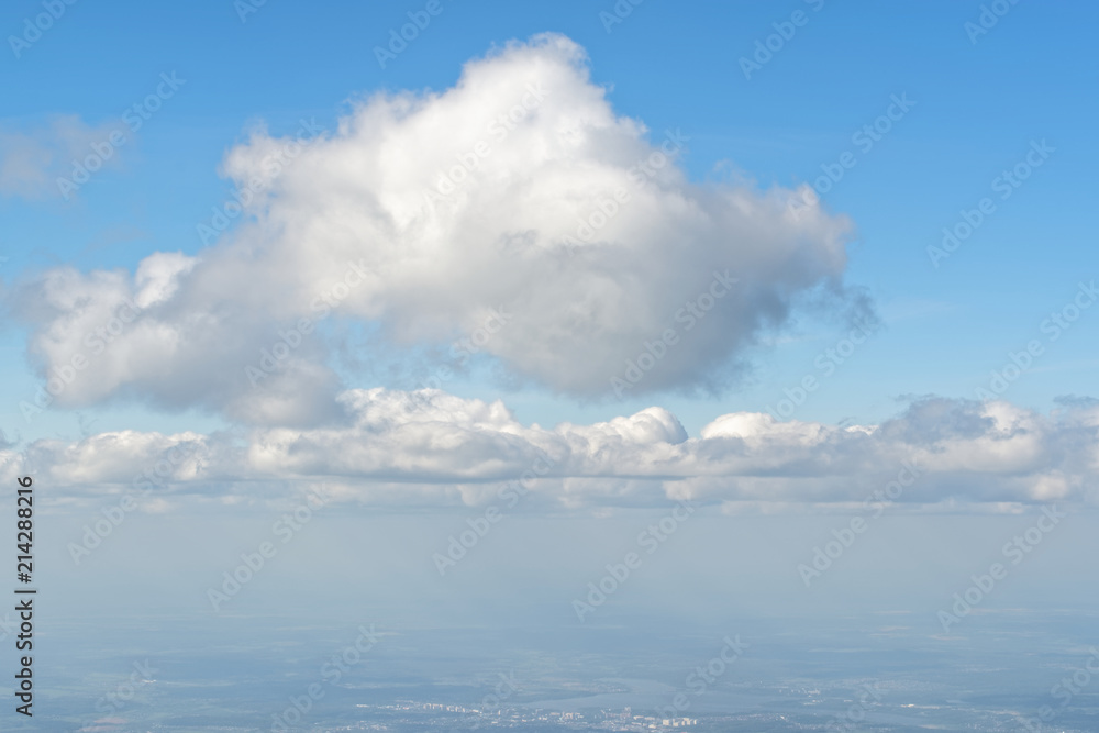 Obraz premium View from porthole, airplane window to beautiful cloudy sky - cloudscape