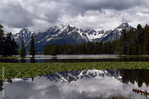 The Tetons reflected in the calm waters of Heron Pond, near Colter Bay in Gran Teton National Park