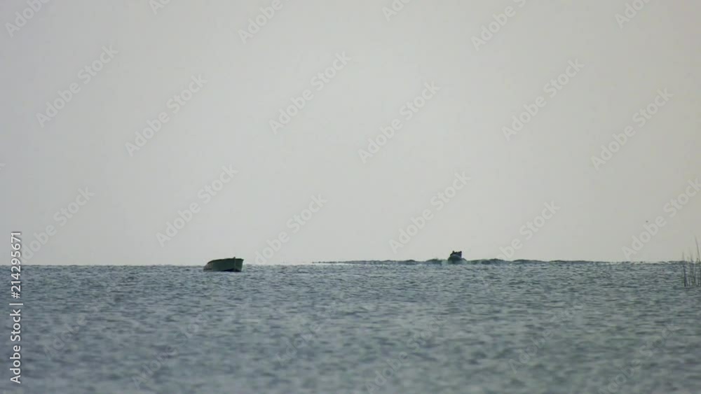 People swim in the boat on the water People swim in the boat on the water