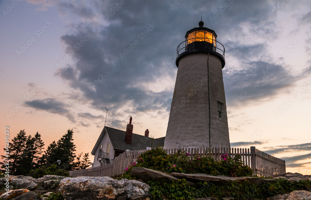 Pemaquid Point Lighthouse at sunset during a calm summer evening in Bristol, Maine