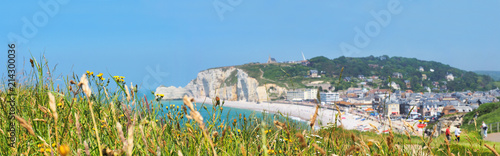 Picturesque panoramic landscape of Etretat  commune. Natural cliff and beach. Etretat, Normandy, France, La Manche or English Channel. Coast of the Pays de Caux area in sunny summer day