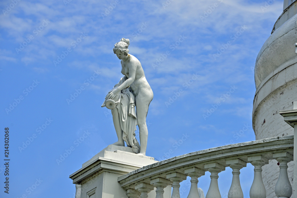 Vintage statue on top of tower