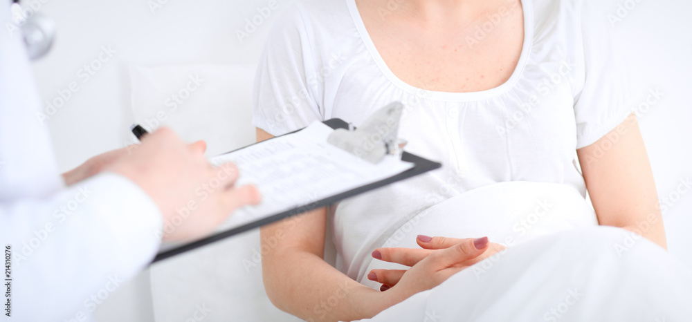 Unknown male doctor and patient discussing medication at hospital. Medicine and healthcare concepts Unknown male doctor and patient discussing medication at hospital. Medicine and healthcare concepts