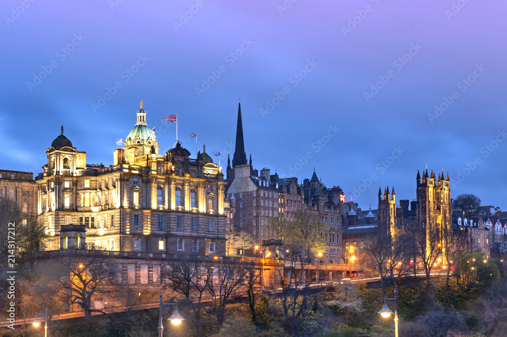 Cityscape in old town district of Edinburgh City being lit up at night in central Edinburgh, Scotland, UK