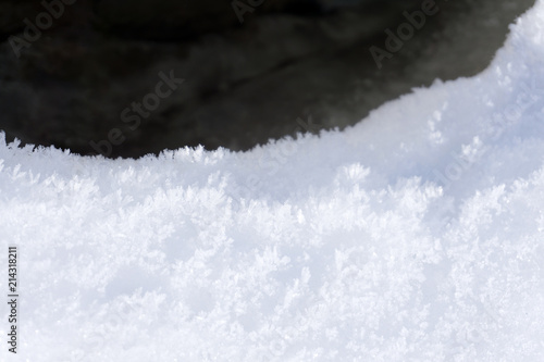 Winter mountain top with fairy overhang snow cap .
