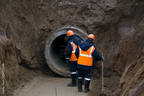 Repair of city water supply. Replacement of old rusty metal pipes on plastic pipes. New modern technologies of urban engineering networks. City Water Pipeline .