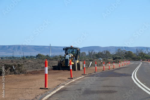 Port Augusta South Australia, grader clearing the bush along side of highway photo