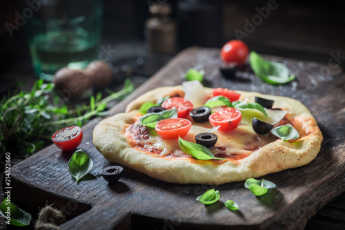 Closeup of homemade pizza made of cheese and tomatoes