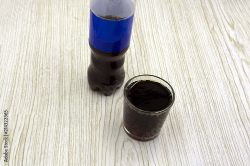 Glass black carbonated water foam kvass dark beer pattern on white background isolation .