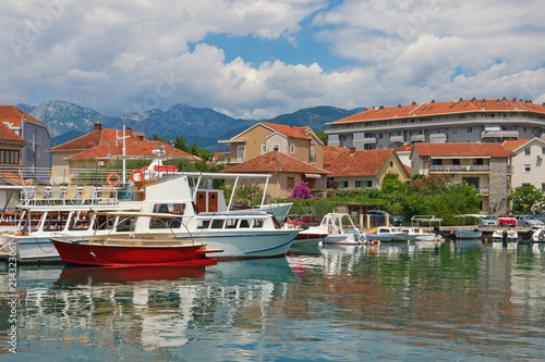 Summer Mediterranean landscape with fishing boats in harbor. Montenegro, Tivat city, view of Marina Kalimanj