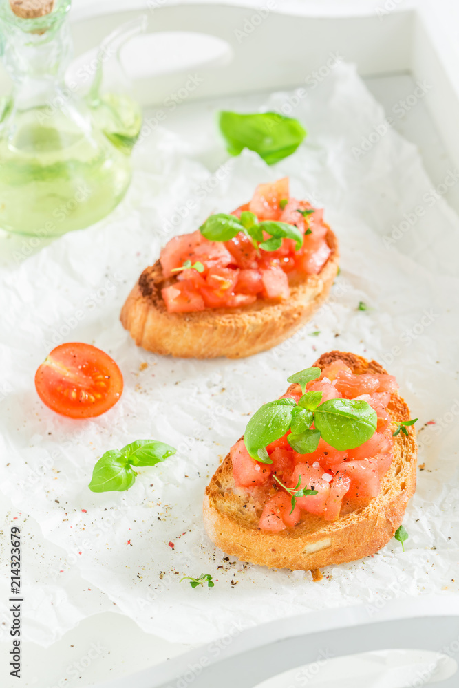 Crisp and fresh bruschetta with basil and tomato