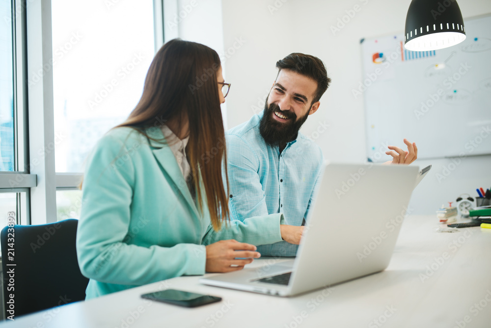 Successful businessmen in the office. Teamwork is easier for two. Young business people are doing a job that they love and are happy about it. Successful businessmen in the office. Teamwork is easier for two. Young business people are doing a job that they love and are happy about it.