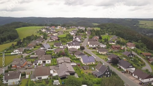  Incredible view from a height to a small town in Germany. Houses, plots, gardens and forests. Nature, summer