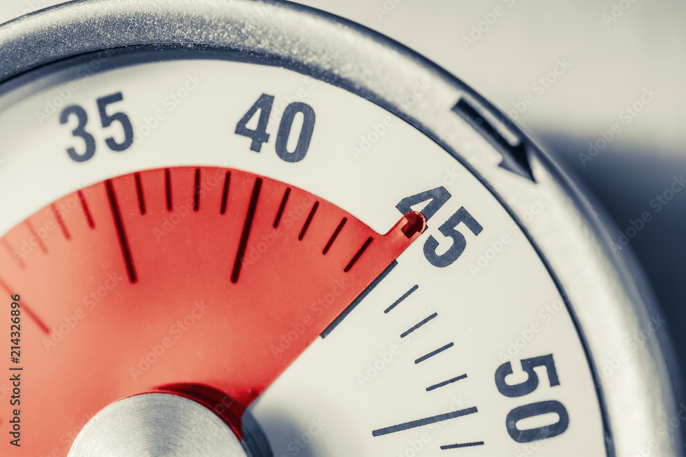 45 Minutes - Analog Kitchen Timer With Red Mark Placed On A Fridge In Monochrome Colors 45 Minutes - Analog Kitchen Timer With Red Mark Placed On A Fridge In Monochrome Colors