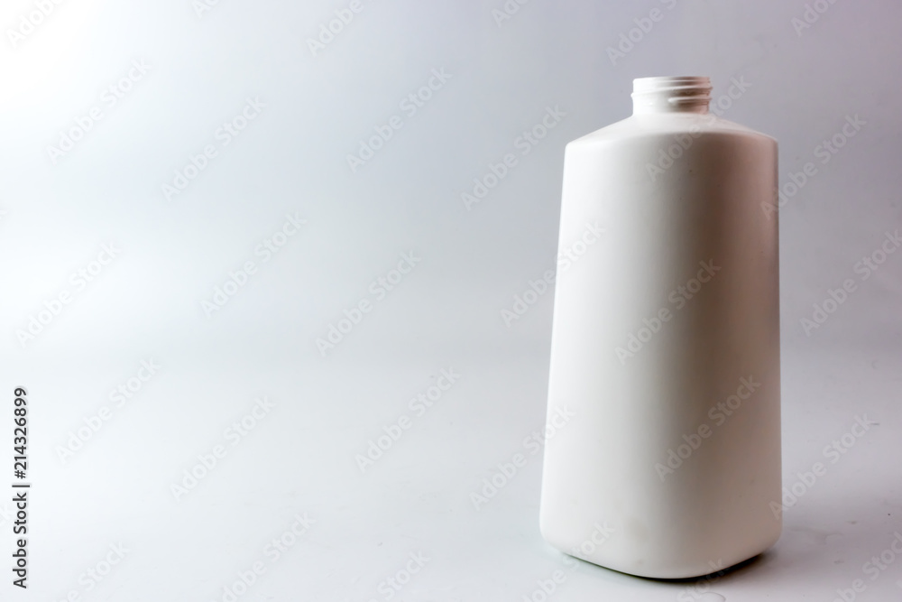 White plastic bottle with spiral on top mouth White plastic bottle with spiral on top mouth