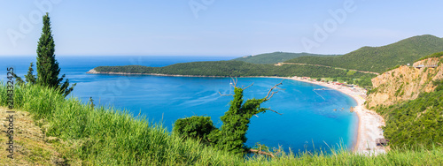 View from above on Adriatic sea coastline and Jaz beach at Montenegro, nature landscape, vacations to the summer paradise, panoramic view