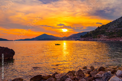 Awesome gold colored sunset on the Adriatic sea coastline in Montenegro, gorgeous seascape