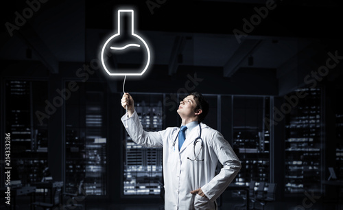 Doctor and medical vial symbol