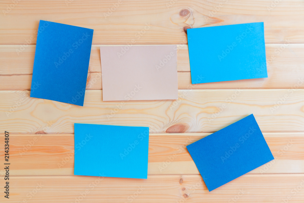 Paper cards on wooden background Paper cards on wooden background