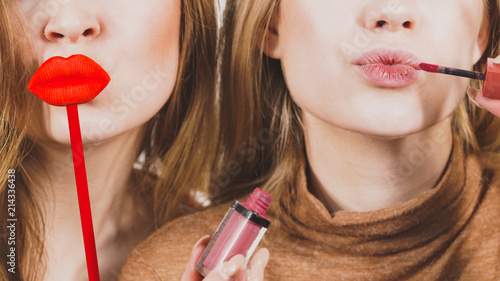 Two women and lip product