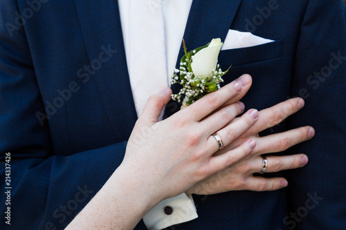 Groom and brides hands with rings close-up © pavelgulea