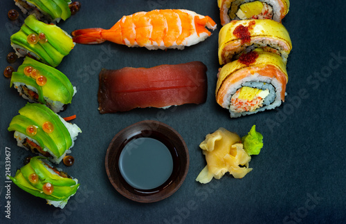 Japanese sushi set on black slate and free copy space