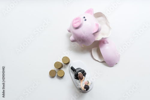 statuette of groom and bride with coins Broken pink pig moneybox top view