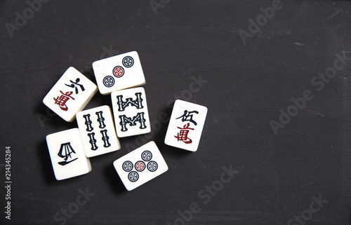 pile of Mahjong on black table photo