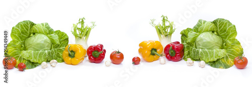 Panoramic view of a Green cabbage. Yellow pepper. Red tomatoes and cucumbers on a white background.