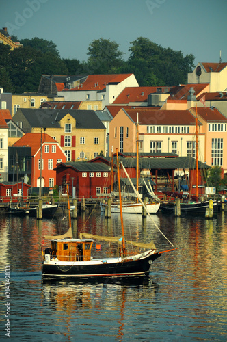 Germany - the bay in Flensburg city. Boats and colorful buildings