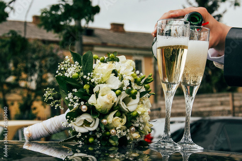 Hand with bottle of champagne