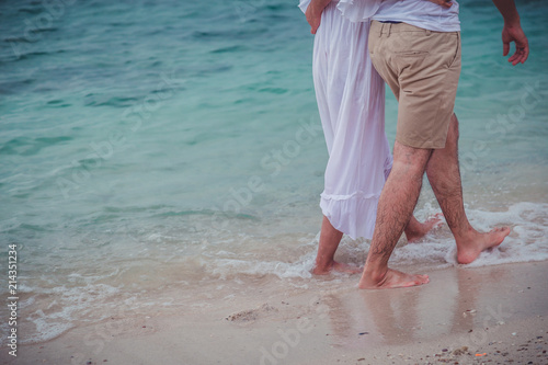 Couple Happy honeymoon romantic in love at beach sunset. in love on the beach.