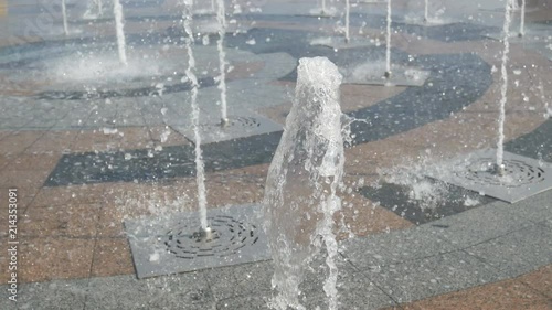 city fountain with a variable stream of water in the center of the city photo