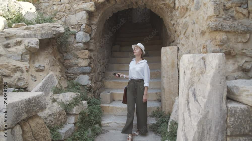 Female tourist looking around the ancient ruins in Izmir, Turkey Female tourist looking around the ancient ruins in Izmir, Turkey