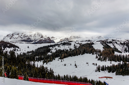 Beautiful view at the alpine village Corvara ski resort in Dolomites mountains, Alps region, Italy photo