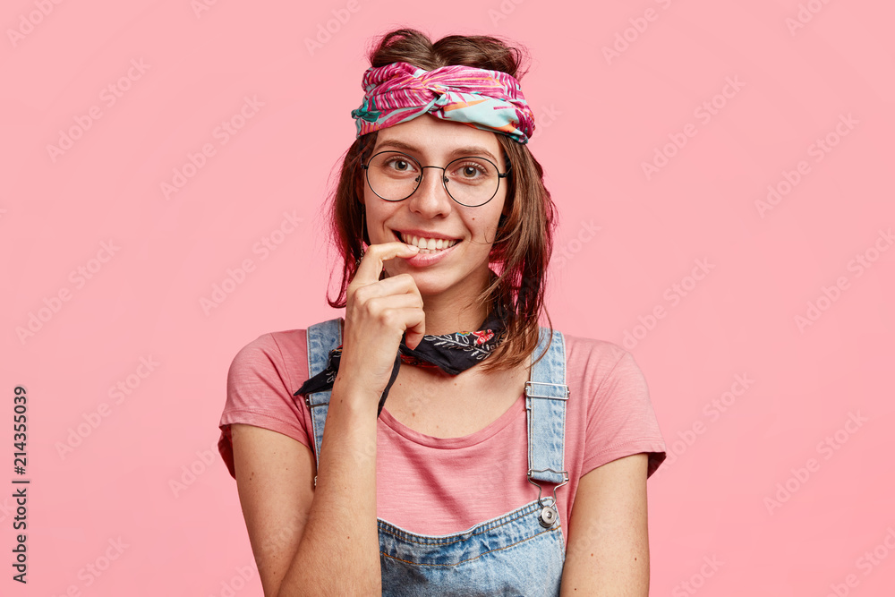 People, subculture and freedom concept. Delighted satisfied hippie woman  with gentle smile, meets with friend, have pleasant talk, wears stylish  bandana on head, isolated over pink background Stock Photo | Adobe Stock