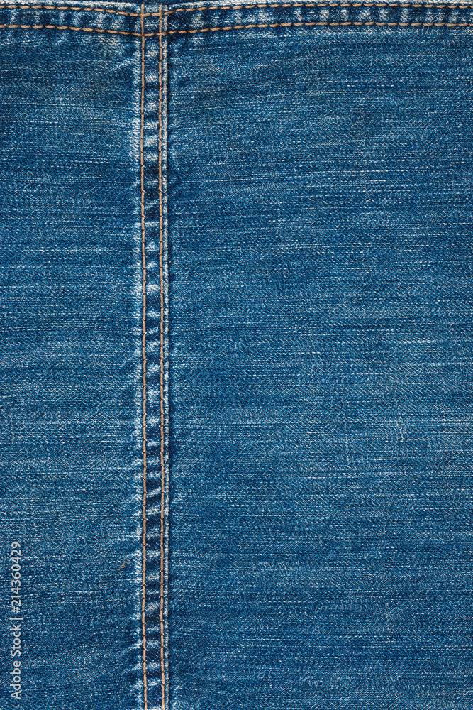 Double yellow seam on denim, background, texture. Double yellow seam on denim, background, texture.