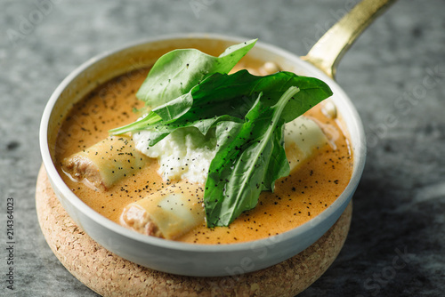 cannelloni on a plate with meat photo