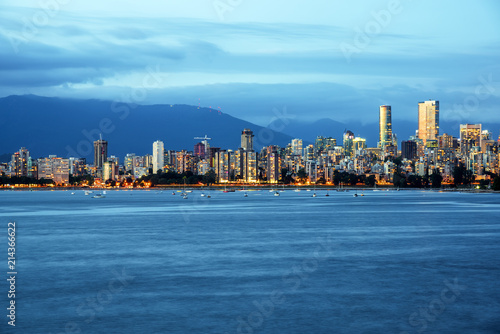 Vancouver Skyline and English Bay under Storming Clouds at Dusk. Vancouvder, BC, Canada.
