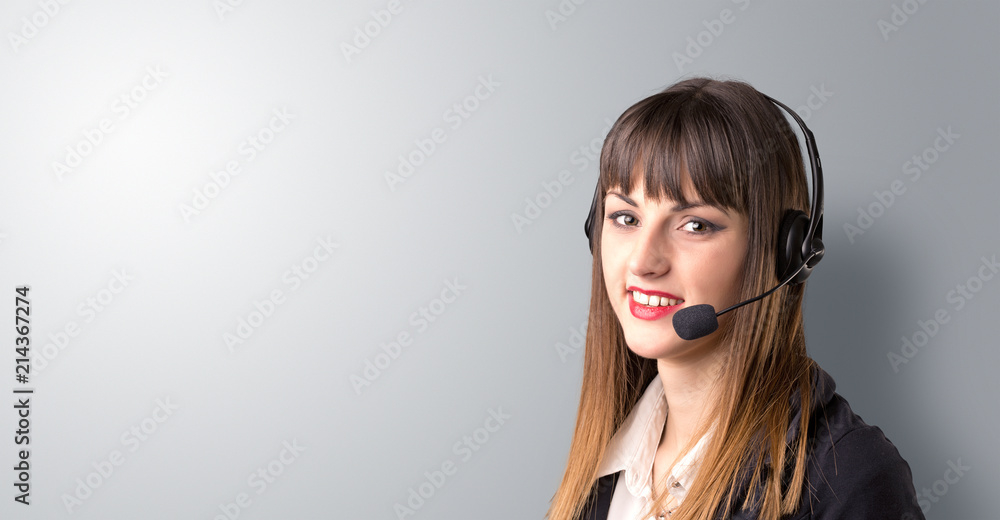 Young female telemarketer on a white background Young female telemarketer on a white background
