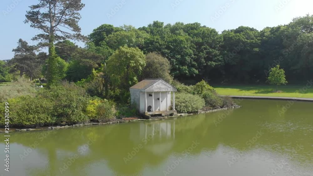Fly by little house by artificial lake, blackrock park, dublin, ireland Fly by little house by artificial lake, blackrock park, dublin, ireland