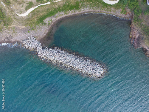 Aerial view of jetty protecting beach in Saint Kitts and Nevis © juancramosgonzalez