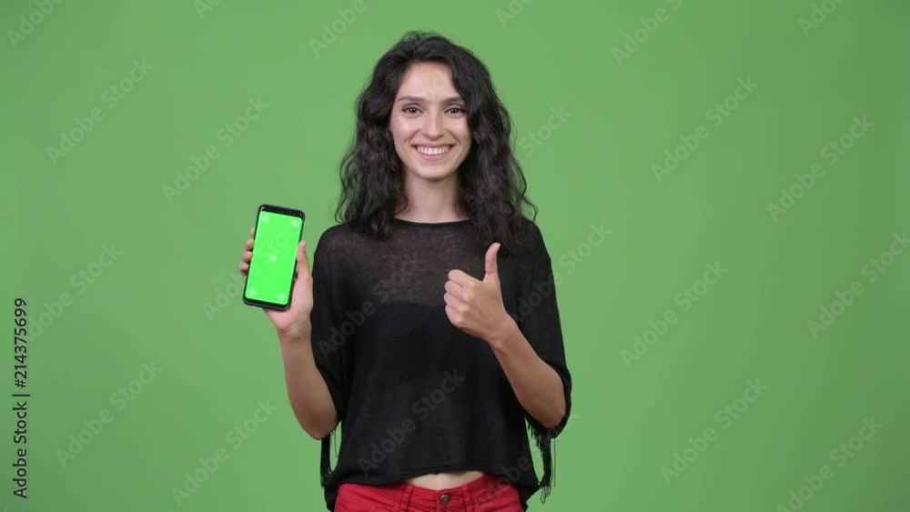 Young beautiful woman showing phone Young beautiful woman showing phone