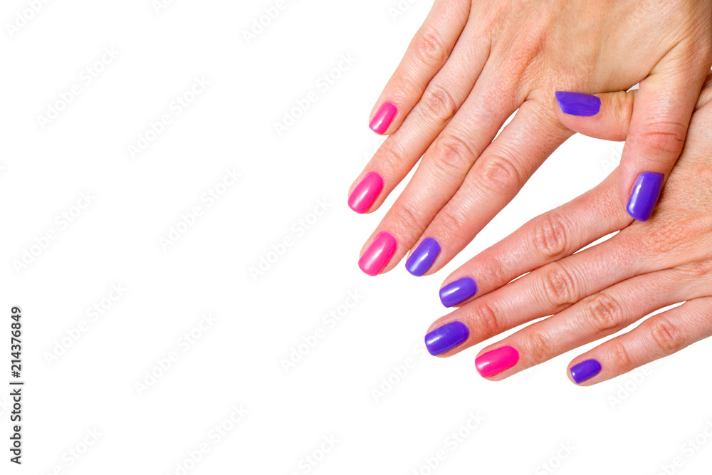 Beauty, fashion and Nail art concept. Manicure in nail spa salon -woman hands close-up with colored pink and purple gel nail polish. isolated on white background. copy space Beauty, fashion and Nail art concept. Manicure in nail spa salon -woman hands close-up with colored pink and purple gel nail polish. isolated on white background. copy space