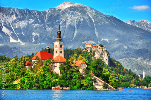  Bled lake island with Pilgrimage Church of the Assumption of Maria and the famous old castle on the cliff.Bled lake Slovenia Europe   