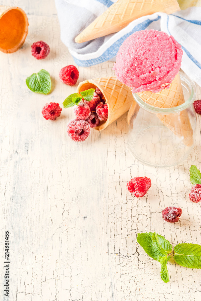 Summer sweet berries and desserts, various of ice cream flavor in cones pink (raspberry), vanilla and chocolate with mint on light concrete background copy space Summer sweet berries and desserts, various of ice cream flavor in cones pink (raspberry), vanilla and chocolate with mint on light concrete background copy space
